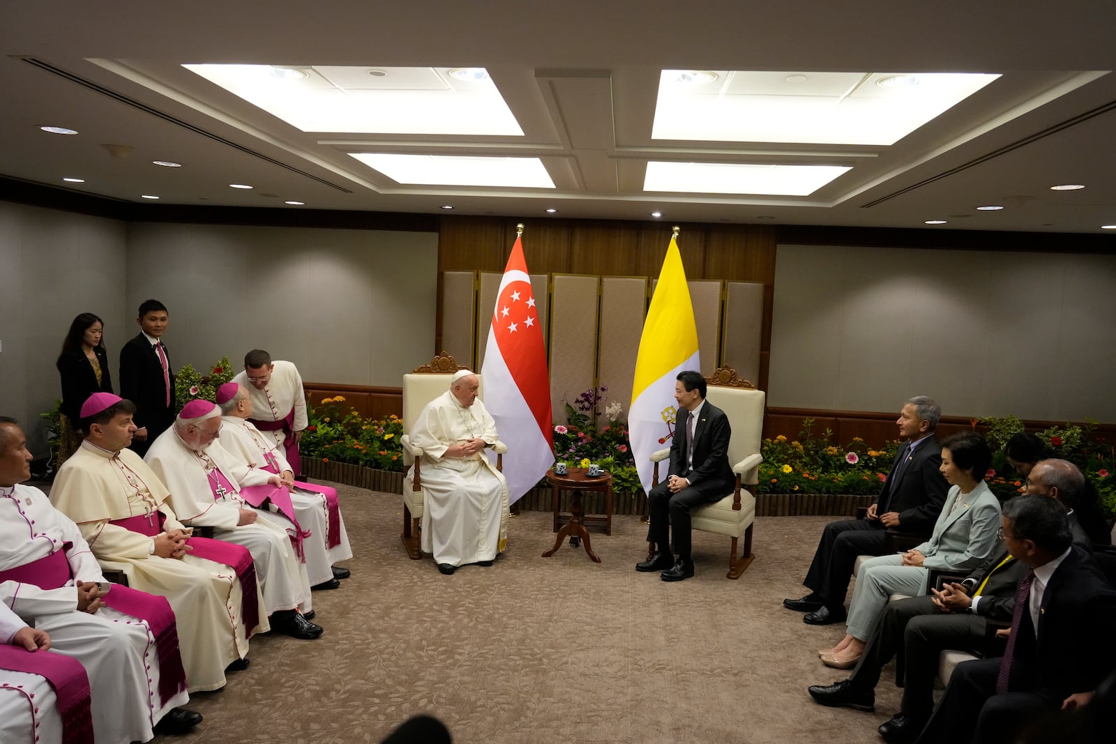 Pope Francis meets with the Prime Minister of Singapore, Lawrence Wong, center right, at the Parliament House in Singapore, Thursday, Sept. 12, 2024. Pope Francis flew to Singapore on Wednesday for the final leg of his trip through Asia, arriving in one of the world's richest countries from one of its poorest after a record-setting final Mass in East Timor. (AP Photo/Gregorio Borgia, pool)