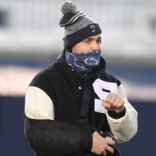 Injured Penn State tight end Pat Freiermuth walks onto the field for pregame before game against Illinois Saturday, Dec. 19, 2020, in State College, Pa. (Barry Reeger/AP)