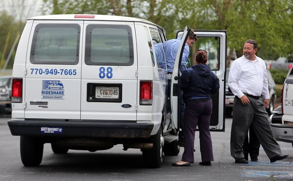 April 15, 2014 Douglasville: Rideshare vans were used to shuttle mourners to the visitation for Cpt. Herb Emory Tuesday afternoon April 15, 2014 in Douglasville. BEN GRAY / BGRAY@AJC.COM