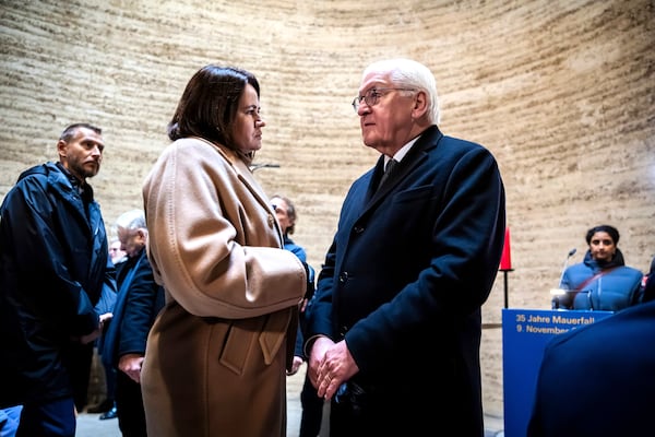 German President Frank-Walter Steinmeier, right, and Belarusian opposition leader Svetlana Tikhanovskaya talk to each other before a prayer at the central commemorative event to mark 35 years of peaceful revolution and the fall of the Berlin Wall, in the Chapel of Reconciliation at the Berlin Wall Memorial, Saturday, Nov. 9, 2024. Christoph Soeder/dpa via AP)