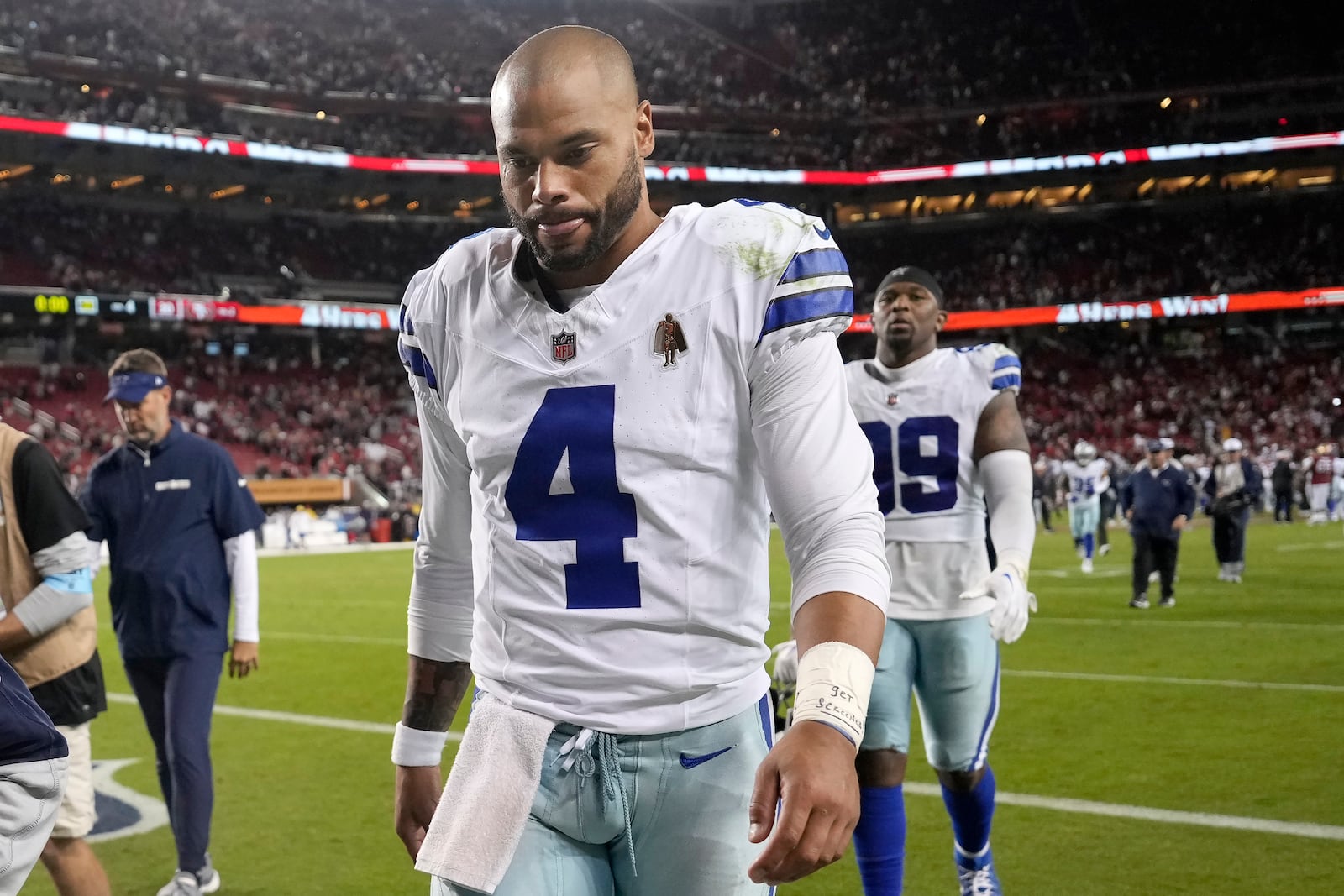 Dallas Cowboys quarterback Dak Prescott (4) walks off the field after an NFL football game against the San Francisco 49ers in Santa Clara, Calif., Sunday, Oct. 27, 2024. (AP Photo/Tony Avelar)