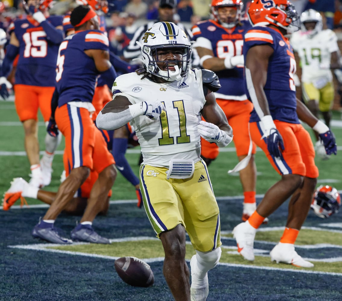 Georgia Tech Yellow Jackets running back Jamal Haynes (11) scores Tech's first touchdown during the first half of an NCAA college football game between Georgia Tech and Syracuse in Atlanta on Saturday, Nov. 18, 2023.   (Bob Andres for the Atlanta Journal Constitution)