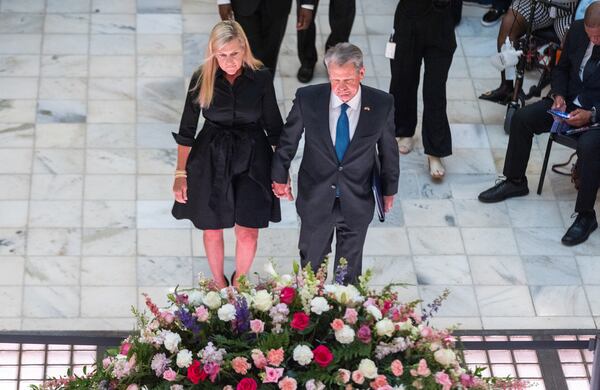 Gov. Brian Kemp (right) and his wife Marty pay respects at a ceremony honoring teacher and civil rights activist Christine King Farris, Martin Luther King Jr.’s sister, in the rotunda of the Capitol in Atlanta on Friday, July 14, 2023. (Arvin Temkar / arvin.temkar@ajc.com)