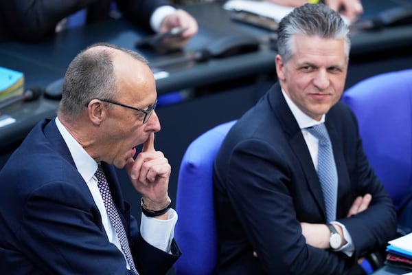 German opposition leader and Christian Democratic Union party chairman Friedrich Merz attends a debate and voting about loosen the country's debt rules and change constitution in the German Parliament Bundestag in Berlin, Germany, Tuesday, March 18, 2025. (AP Photo/Ebrahim Noroozi)