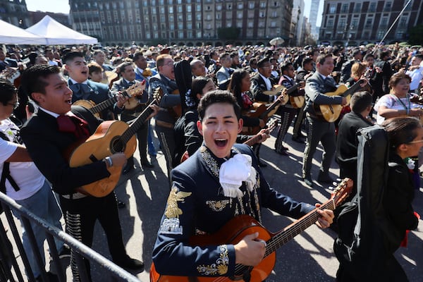 Musicians gather to break the record of most mariachis performing in unison, at the Zocalo, Mexico City's main square, Sunday, Nov. 10, 2024. (AP Photo/Ginnette Riquelme)