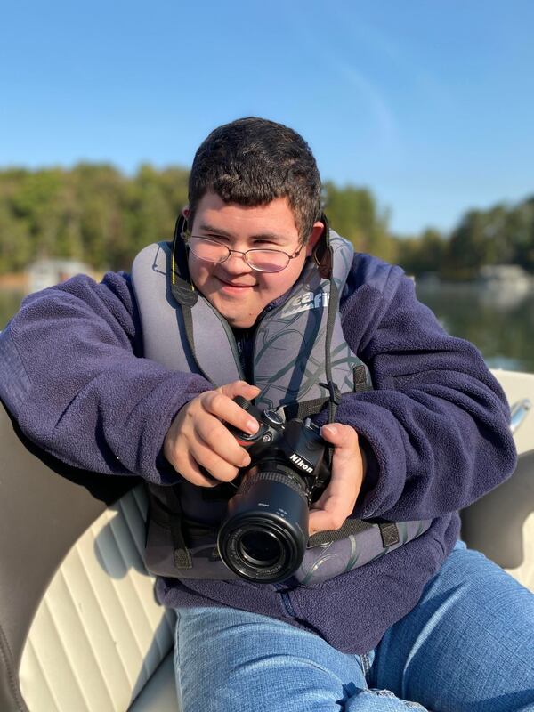 Jonathan Gross smiles with his digital camera. Courtesy of Michaela Cooper