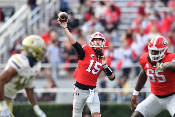 November 26, 2022 Athens - Georgia's quarterback Carson Beck (15) throws a pass during the second half in an NCAA football game at Sanford Stadium in Athens on Saturday, November 26, 2022. Georgia won 37-14 over Georgia Tech. (Hyosub Shin / Hyosub.Shin@ajc.com)