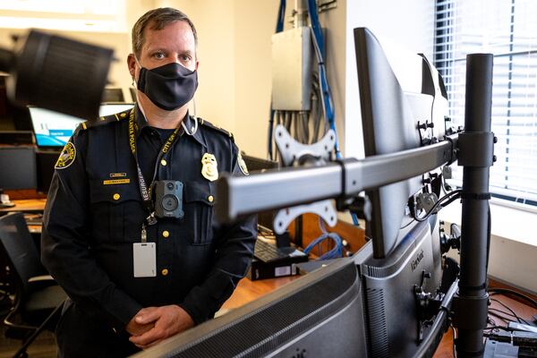 Captain Jeff Baxter, assistant director of the call center, in the center's training room on Wednesday, Dec. 23. A 23-year veteran at APD, Baxter began his role with the call center in September. (Casey Sykes for The Atlanta Journal-Constitution)