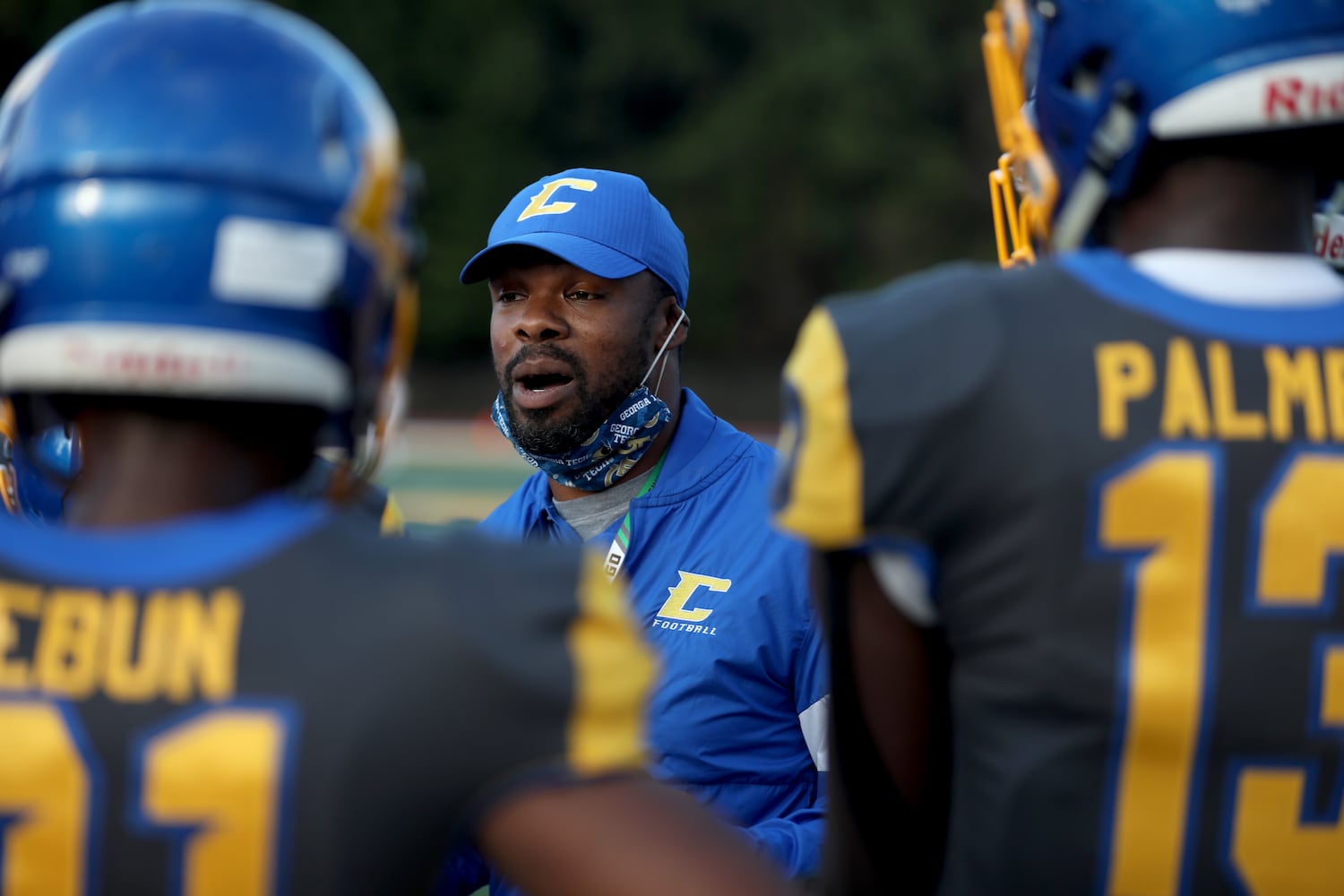 Chattahoochee head coach Mike Malone talks with members of his team before their game against Alpharetta at Chattahoochee high school Friday, September 25, 2020 in Johns Creek, Ga.. JASON GETZ FOR THE ATLANTA JOURNAL-CONSTITUTION