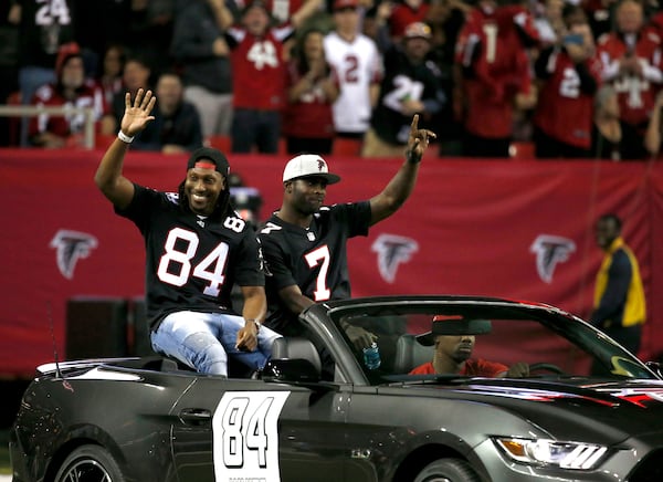 Former Atlanta Falcons quarterback Michael Vick is honored during halftime of a Falcons game in 2017.