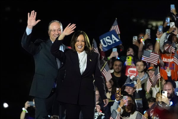 Vice President Kamala Harris (right) and second gentleman Doug Emhoff greet supporters at a campaign rally on the Ellipse in Washington on Tuesday.