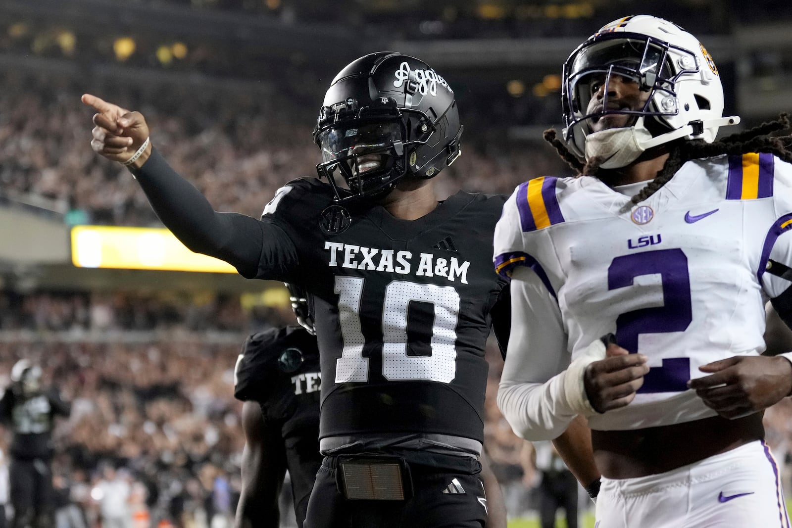 Texas A&M quarterback Marcel Reed (10) reacts after scoring a touchdown against LSU during the third quarter of an NCAA college football game Saturday, Oct. 26, 2024, in College Station, Texas. (AP Photo/Sam Craft)