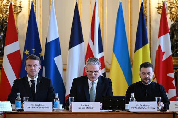 Britain's Prime Minister Keir Starmer, center, France's President Emmanuel Macron, left, and Ukraine's President Volodymyr Zelenskyy at the European leaders' summit to discuss Ukraine, at Lancaster House, London, Sunday March 2, 2025. (Justin Tallis/Pool via AP)