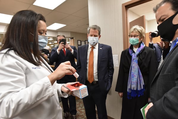 In this file photo, Kroger pharmacist Michelle Blalock discussed the Moderna COVID-19 vaccine as Governor Brian Kemp and Georgia Department of Public Health Commissioner Dr. Kathleen Toomey tour the COVID-19 vaccination clinic at Kroger pharmacy in Cherokee Plaza in Brookhaven. (Hyosub Shin / Hyosub.Shin@ajc.com)