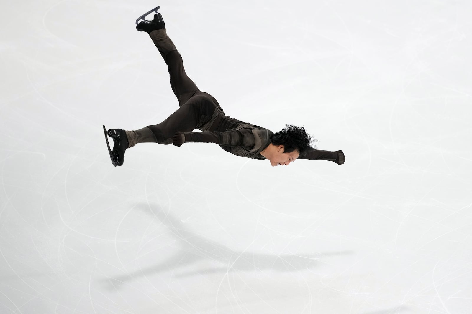 Adam Siao Him Fa, of France, competes in the men's free skating segment at the ISU Grand Prix of Figure Skating, Saturday, Nov. 2, 2024, in Angers, France. (AP Photo/Aurelien Morissard)