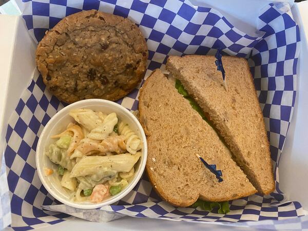 Blue Rooster offers a variety of boxed lunches, ranging in price from $8.95 to $10.95, and including a choice of sandwich, pasta salad, potato salad, fresh fruit or chips and a cookie or brownie. Ligaya Figueras/ligaya.figueras@ajc.com