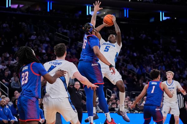 Creighton's Jamiya Neal (5) shoots over DePaul's NJ Benson (35) during the first half of an NCAA college basketball game at the Big East basketball tournament Thursday, March 13, 2025, in New York. (AP Photo/Frank Franklin II)