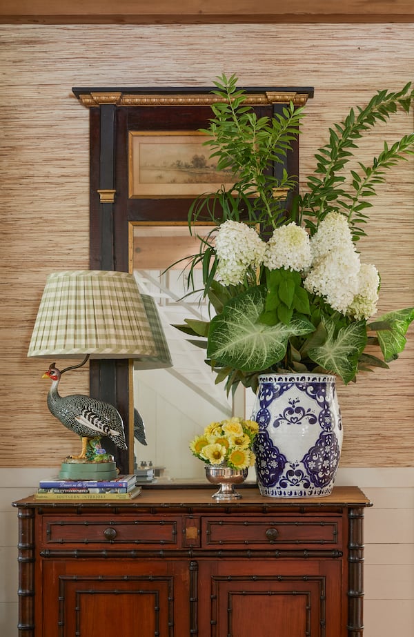 Interior designer James Farmer thinks a key element of Southern style is mixing high and low as in this arrangement of humble sunflowers in a fancy silver cup.
(Courtesy of Emily Followill)