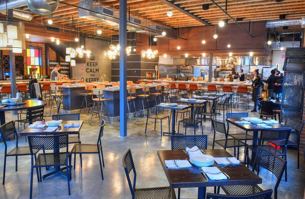 Interior with dining room seating and open kitchen. (Contributed by Chris Hunt Photography)