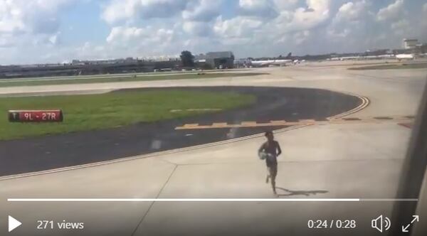 This is a screenshot from a video taken by Garth Magness of a man allegedly approaching an aircraft at Harsfield-Jackson International Airport. Magness gave Channel 2 Action News and the AJC permission to publish the video.