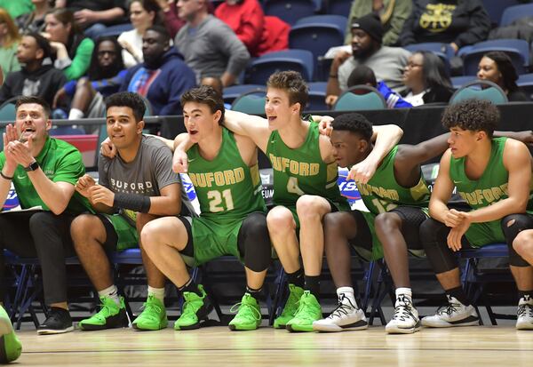 Buford team members react at the end of the fourth quarter in GHSA State Basketball Championship game at the Macon Centreplex in Macon on Friday, March 8, 2019. Buford won 76-69 over the Fayette County. HYOSUB SHIN / HSHIN@AJC.COM