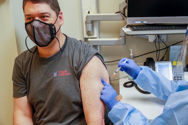 Robert Gilleo receives his monkeypox vaccination from Yolanda Johnson, BSN RN, at the North Dekalb Health Center in Chamblee on August 5, 2022. Steve Schaefer / steve.schaefer@ajc.com)
