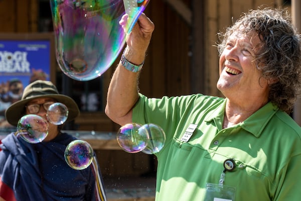 Robin Booth's love of bubbles started when he was gifted a bubble wand at the Yellow Daisy Festival decades ago. (Arvin Temkar / arvin.temkar@ajc.com)