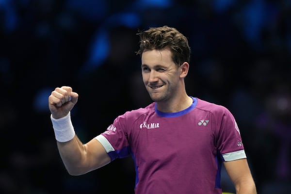 Denmark's Casper Ruud celebrates after winning the singles tennis match of the ATP World Tour Finals against Spain's Carlos Alcaraz, at the Inalpi Arena, in Turin, Italy, Monday, Nov. 11, 2024. (AP Photo/Antonio Calanni)