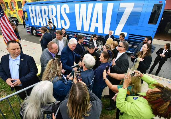 Former President Bill Clinton greets supporters while campaigning for Democratic Party presidential nominee Vice President Kamala Harris during a stop at Bottle Works in the Cambria City section of Johnstown, Pa., Tuesday, Oct. 29, 2024. (Thomas Slusser/The Tribune-Democrat via AP)