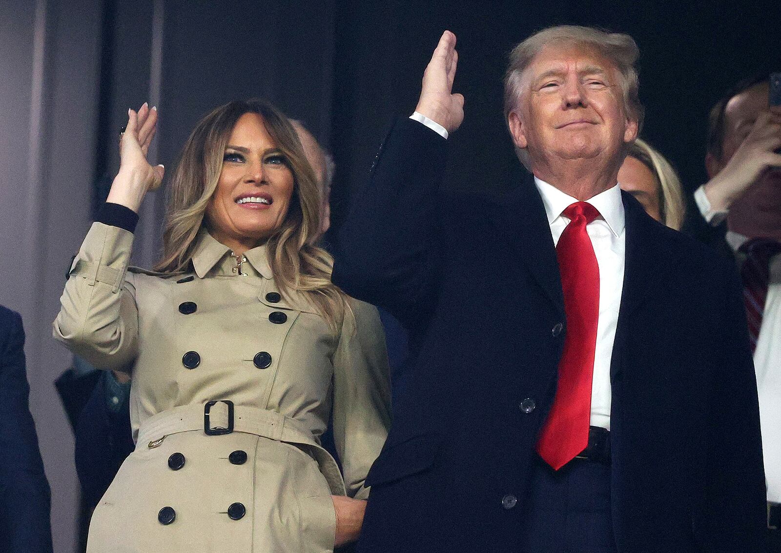 Former first lady Melania Trump and President Donald Trump do the Tomahawk Chop prior to Game 4 of the World Series between the Houston Astros and the Atlanta Braves at Truist Park on Saturday, Oct. 30, 2021, in Atlanta. (Elsa/Getty Images/TNS)