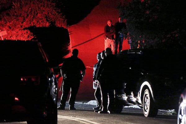 Contra Costa County Sheriff deputies investigate a multiple shooting on Halloween at a rental home in Orinda, Calif.