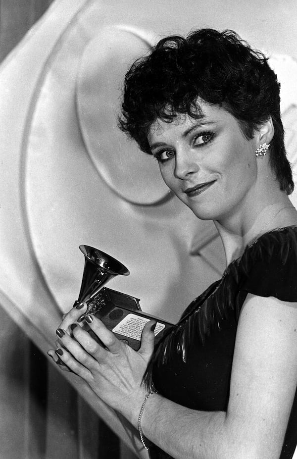 Sheena Easton holds her victrola shaped trophy at the 24th annual Grammy Awards presentation in Los Angeles, Ca., Feb. 24, 1982.  Easton received the award for best new artist of the year for her hits, "Morning Train" and "For Your Eyes Only."   (AP Photo/Reed Saxon)