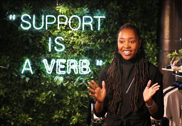 112320 Atlanta: Owner Lakeysha Hallmon discusses the concept of her store The Village at Ponce City Market with a large tag line to the community prominently displayed on one of the main walls on Monday, Nov 23, 2020, in Atlanta.   “Curtis Compton / Curtis.Compton@ajc.com”