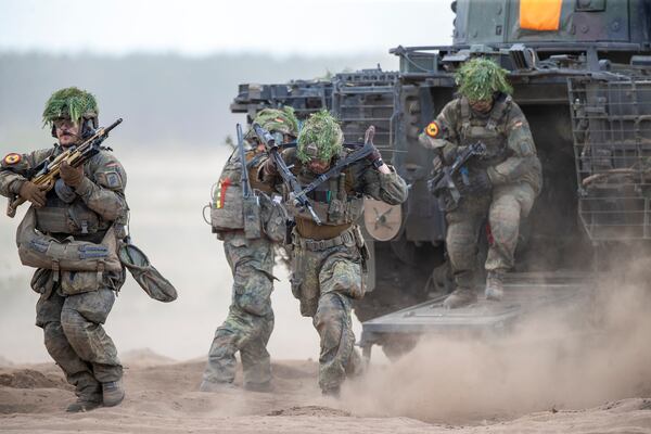 FILE - German soldiers take part in the Lithuanian-German division-level international military exercise 'Grand Quadriga 2024' at a training range in Pabrade, north of the capital Vilnius, Lithuania on May 29, 2024. (AP Photo/Mindaugas Kulbis, File)