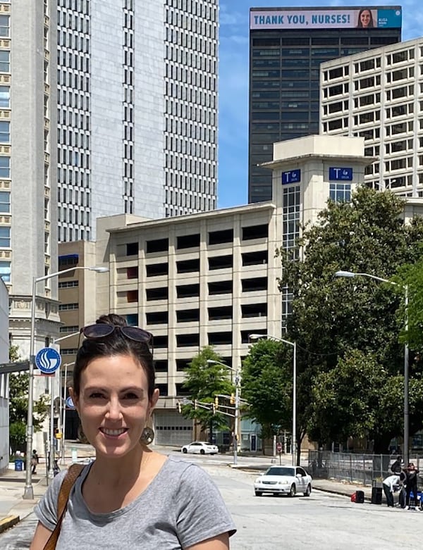 Alisa Moore, a pediatric nurse practitioner at Children’s Healthcare of Atlanta, headed downtown to check out her sign.