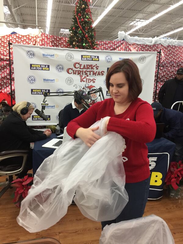  Emily Malkin of Sandy Springs volunteered for Clark's Kids for the first time. "I love this event," she said. "I'm not a crier but this makes me cry." CREDIT: Rodney Ho/rho@ajc.com