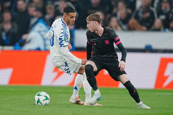 Copenhagen's Elias Achouri, left, and Chelsea's Cole Palmer in action during the Conference League round of 16 soccer match between FC Copenhagen and Chelsea FC at Parken Stadium in Copenhagen, Denmark, Thursday March 6, 2025. (Liselotte Sabroe/Ritzau Scanpix via AP)