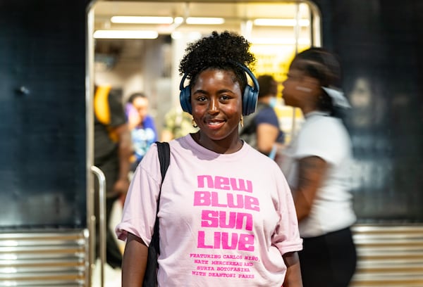 Laura Dunn poses for a portrait while riding a MARTA train in Atlanta on Thursday, August 1, 2024. (Seeger Gray / AJC)