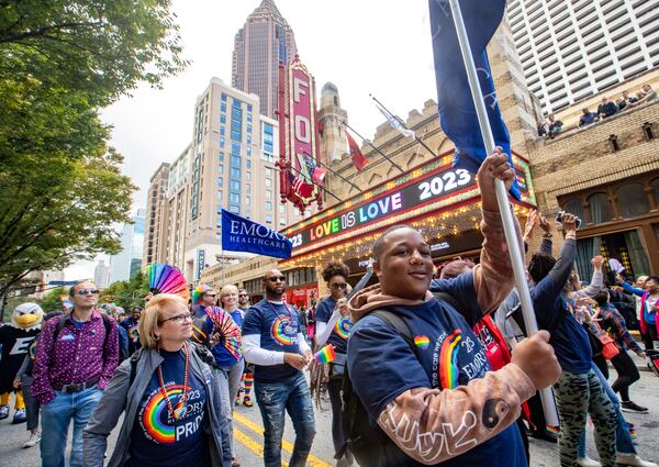 Rodreavious Sears, front right, marches with Emory in the annual Pride Parade on Sunday, Oct 15, 2023.  (Jenni Girtman for The Atlanta Journal-Constitution)