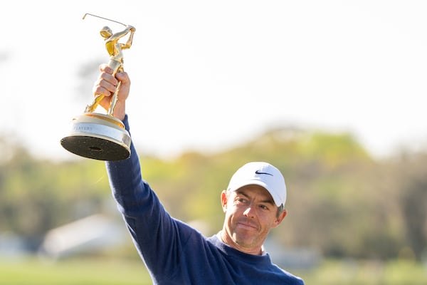 Rory McIlroy, of Northern Ireland, reacts during a trophy ceremony after winning a playoff round of The Players Championship golf tournament Monday, March 17, 2025, in Ponte Vedra Beach, Fla. (AP Photo/Julia Demaree Nikhinson)