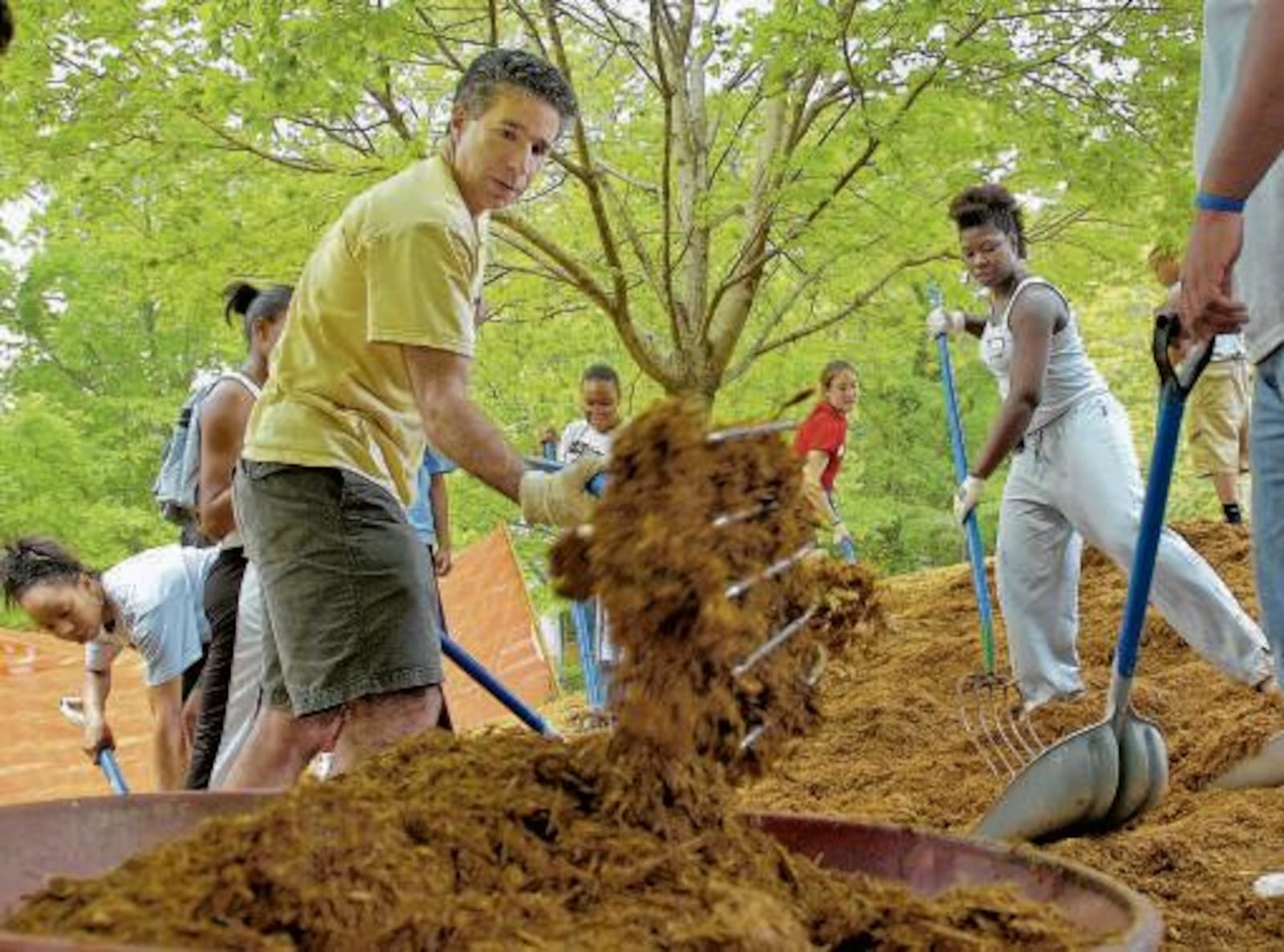 Larry Schall (in yellow) has taken hands-on approach as president of Oglethorpe University. Applications to the small liberal arts college in Brookhaven have quadrupled since he's taken over in 2005.