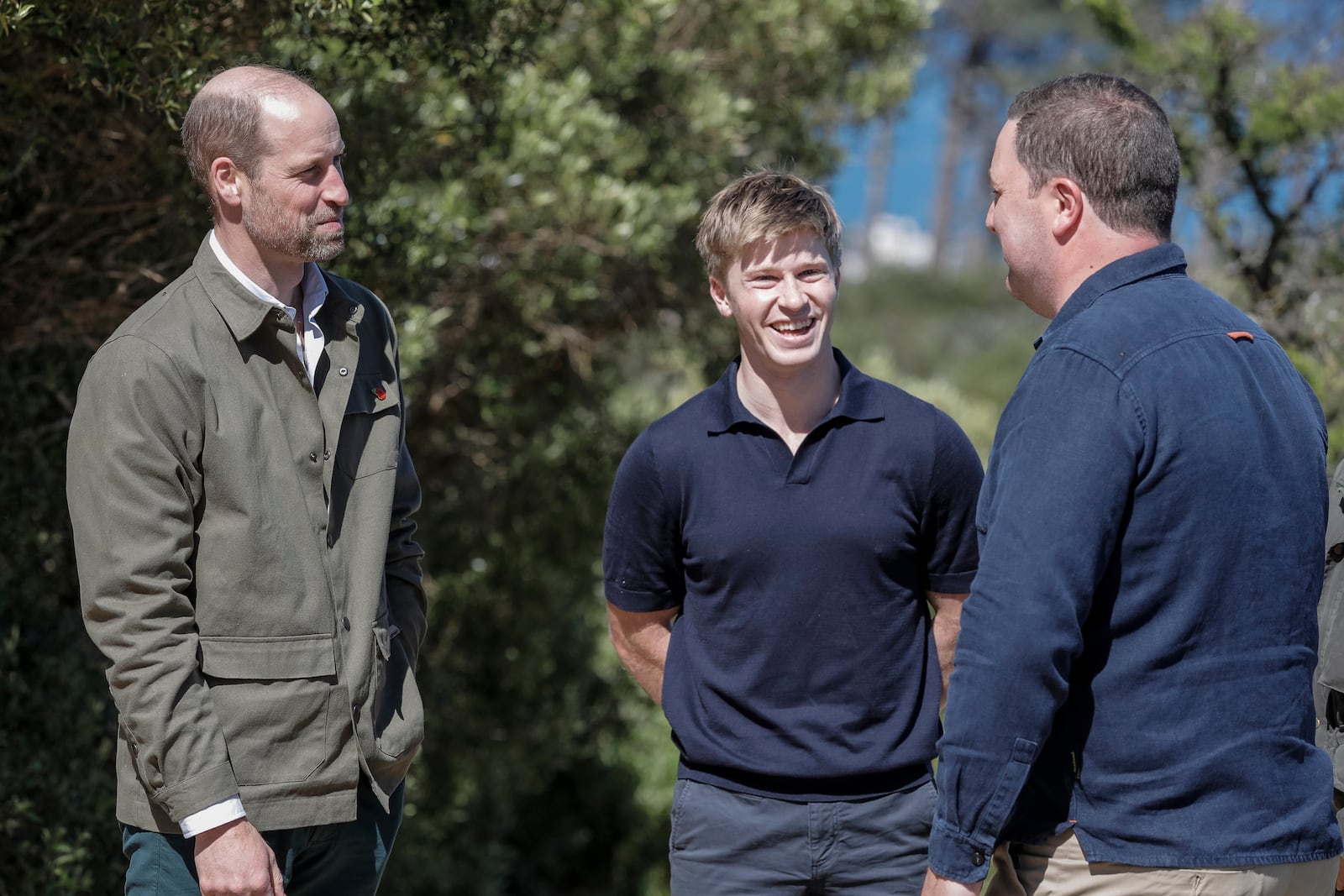 Britain's Prince William, left, talks with Australian conservationist and Earthshot Prize Global Ambassador Robert Irwin, center, and Mayor of the City of Cape Town Geordin Hill-Lewis while visiting Signal Hill in Cape Town, South Africa, Tuesday, Nov. 5, 2024. (Gianluigi Guercia/Pool via AP)