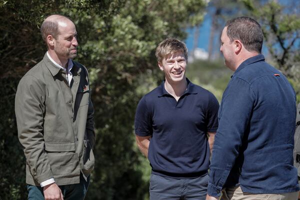 Britain's Prince William, left, talks with Australian conservationist and Earthshot Prize Global Ambassador Robert Irwin, center, and Mayor of the City of Cape Town Geordin Hill-Lewis while visiting Signal Hill in Cape Town, South Africa, Tuesday, Nov. 5, 2024. (Gianluigi Guercia/Pool via AP)