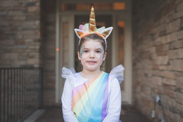 Child in unicorn costume