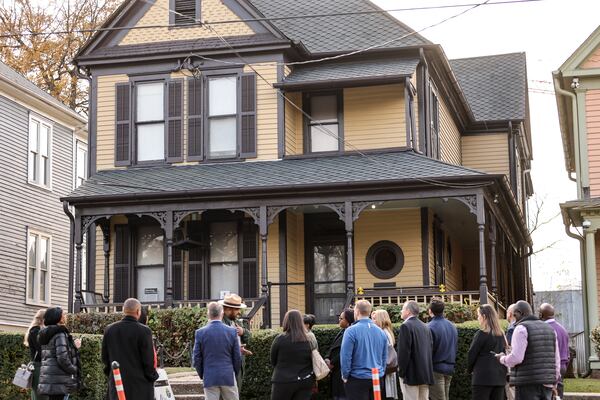 A tour group stands outside of the birth home of Martin Luther King Jr. on Friday, Dec. 8, 2023. A woman was arrested Thursday night after she attempted to set fire to the house. (Natrice Miller/ Natrice.miller@ajc.com)