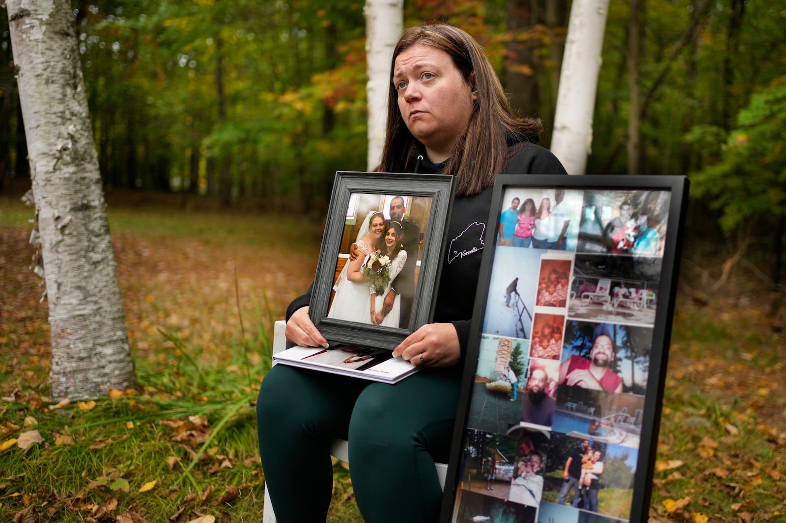 Megan Vozzella shows family photos during an interview about her late husband, Stephen Vozzella, who was one of the people killed in a mass shooting on Oct. 25, 2023, in Lewiston, Tuesday, Oct. 1, 2024, in Oxford, Maine. (AP Photo/Robert F. Bukaty)