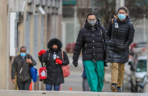 File photo of Grady Hospital healthcare workers arrive for work. (John Spink / John.Spink@ajc.com)

