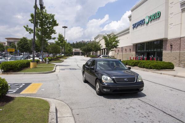 A business group that covers the Camp Creek Marketplace along Camp Creek Parkway hopes for more members of the community to get involved in its efforts to address the crime there. (Jenna Eason / Jenna.Eason@coxinc.com)