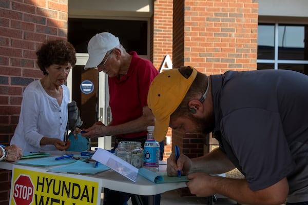 Bulloch County residents sign petitions at Southeast Bulloch High School on Tuesday, August 13, 2024 in Brooklet, GA. (AJC Photo/Katelyn Myrick)