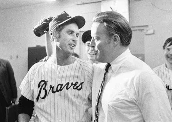 Bill Bartholomay  (right) and relief pitcher Hoyt Wilhelm celebrate the Braves’ 1969 National League West championship. 